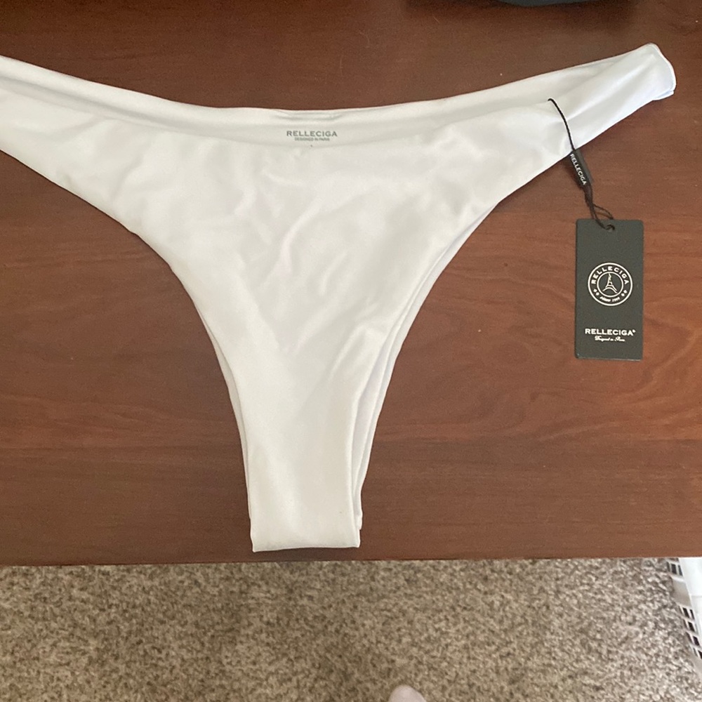 Brand new with tag Relleciga swim bottoms Sz. Large white